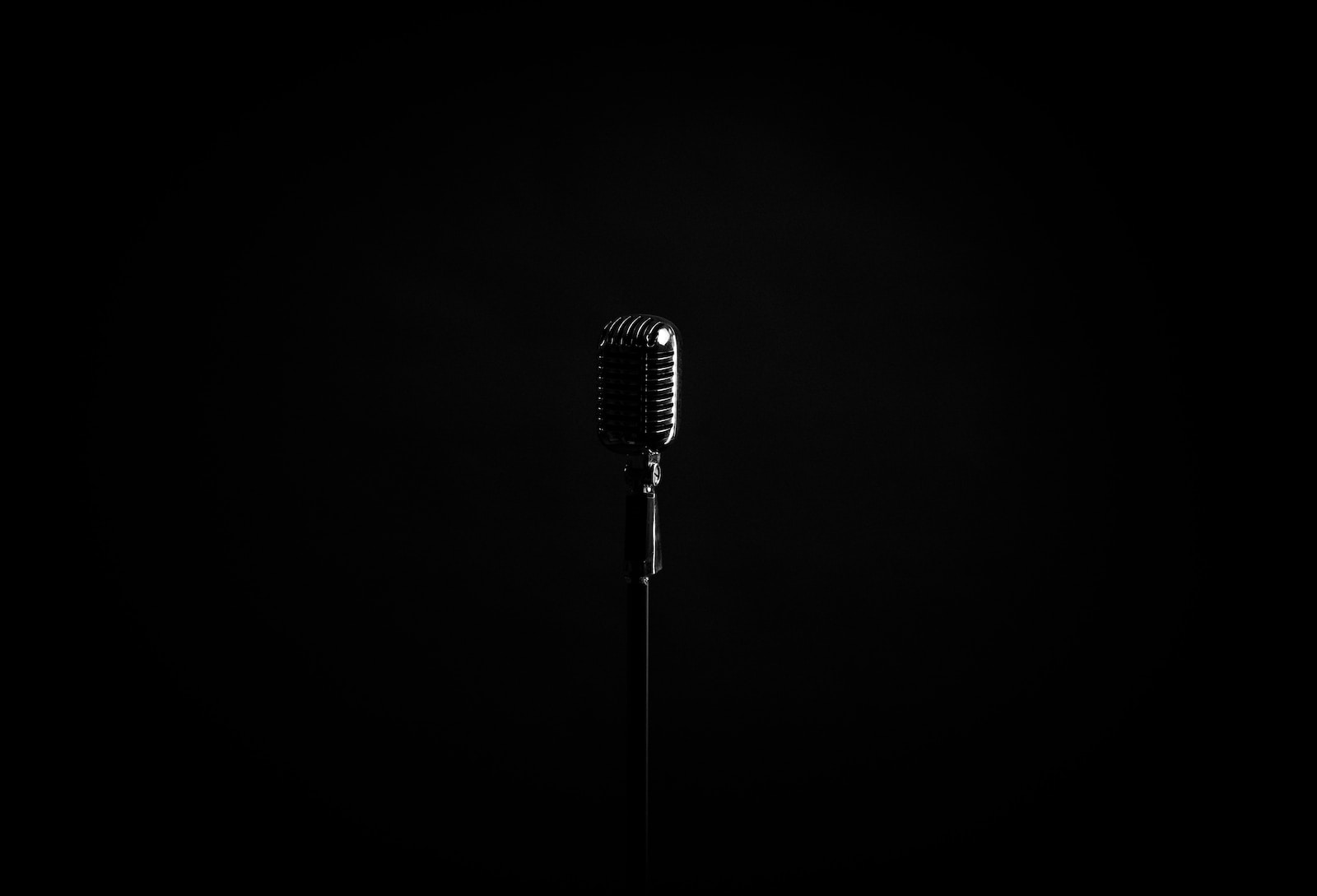 black microphone on black background